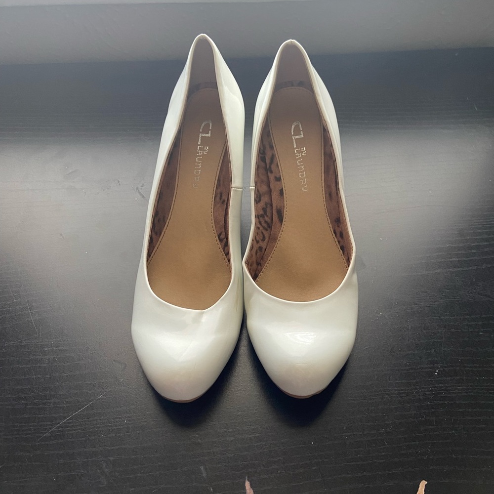 Shiny white heels with a 3 inch heel